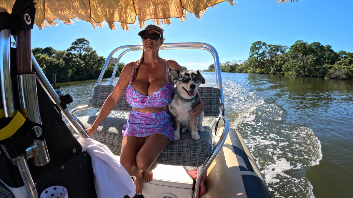 Brandy aboard the boat on turquoise water